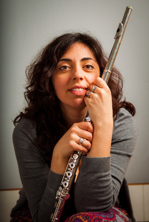 Gala Yaroshevsky, founder and executive director, holding a flute